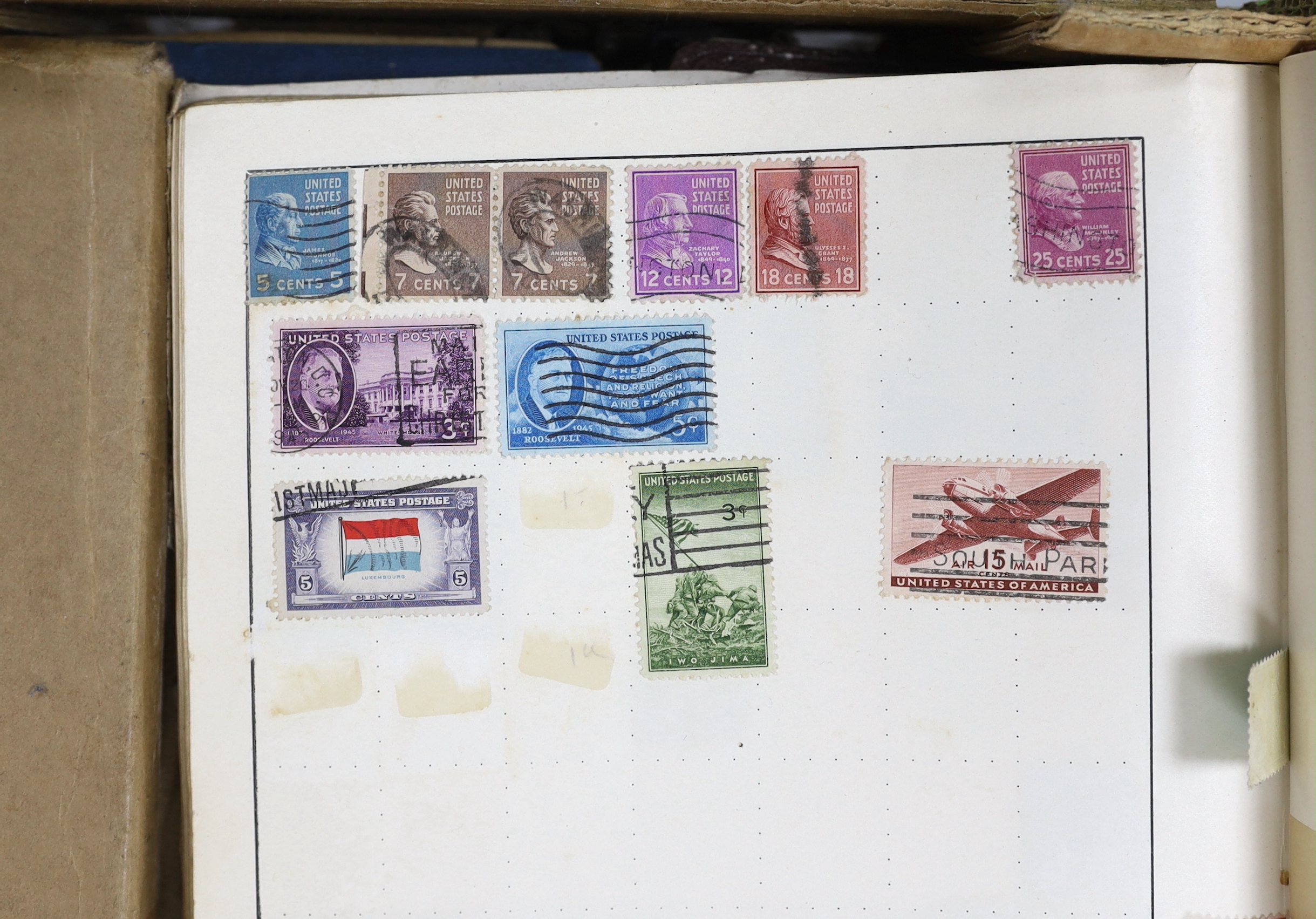 A box of mixed stamp albums